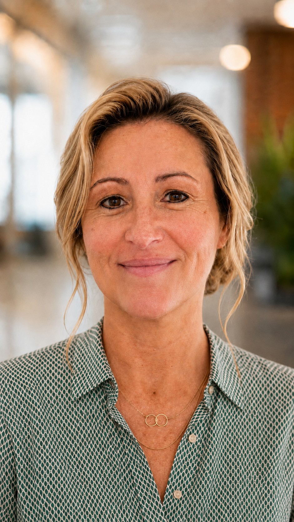 Renee Bannon Baker in green patterned blouse